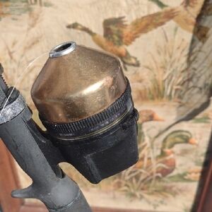 Shakespeare Graphite Composite Vintage Black and Gold Fishing Reel